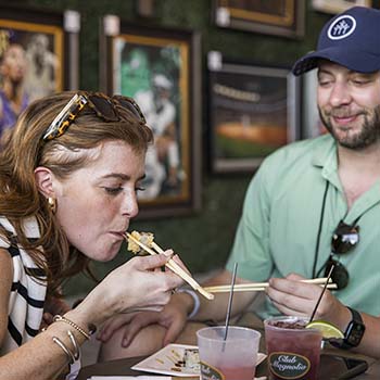 Couple enjoys sushi in the Grand Marquee